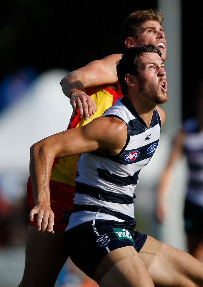 AFL 2015 NAB Challenge - Gold Coast v Geelong Zac Smith of the Suns and Padraig Lucey of the Cats in action during the 2015 NAB Challenge Week 1 match between the Gold Coast Suns and the Geelong Cats at Tony Ireland Stadium, Townsville on March 01, 2015. (Photo: Sean Garnsworthy/AFL Media)